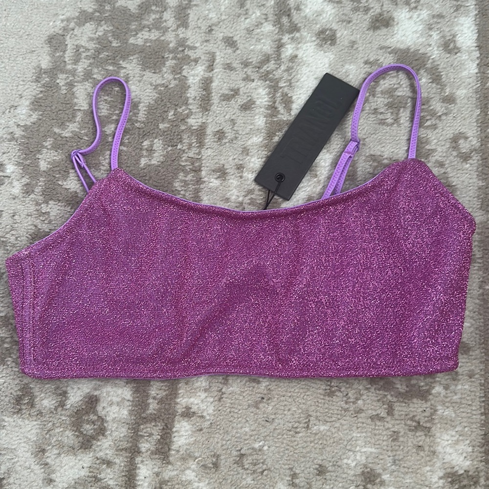 This swimsuit top is a size M from the brand triangl, never worn,still has tags.